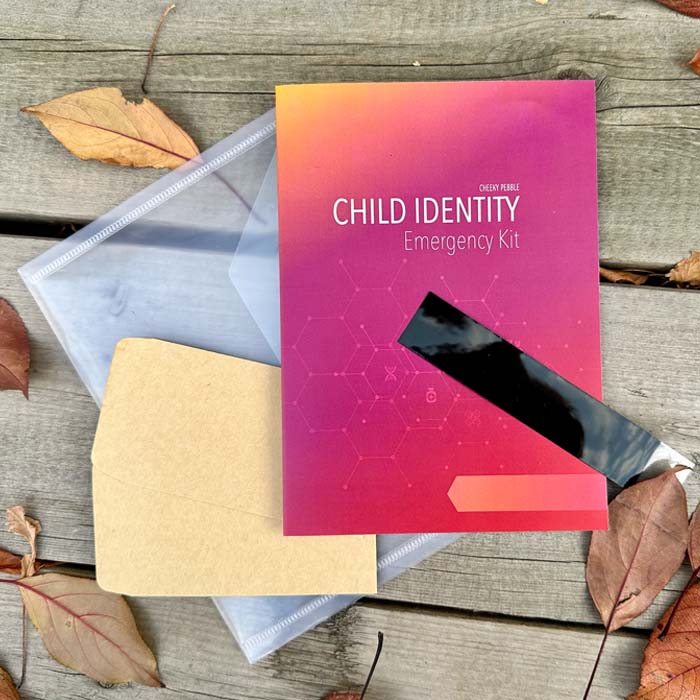 Child Identity kit showing pamphlet, ink strip, envelopes for DNA collection and plastic sleeve that contains everything. By Cheeky Pebble.