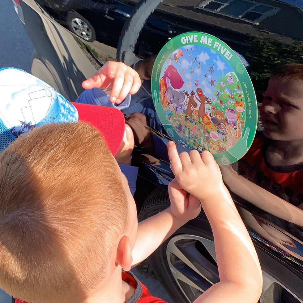 Picture of 2 4 year old boys counting ladybugs on the Animal Kid Katcher magnet by Cheeky Pebble.
