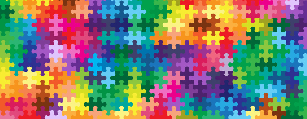 Rainbow coloured puzzle pieces fitted together