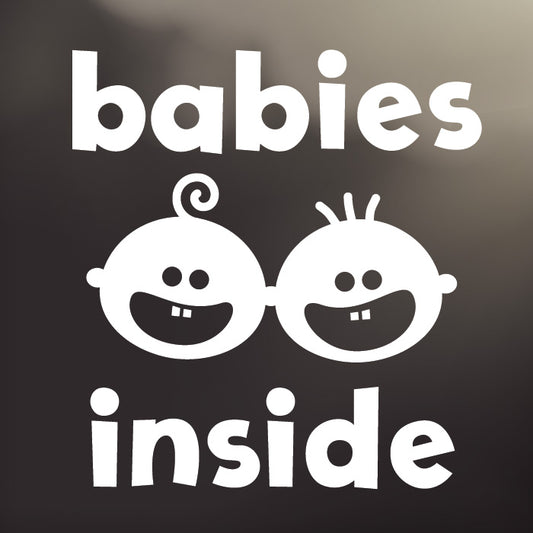 ‘Babies Inside’ large, white vinyl, back window decal by Cheeky Pebble with iconic Cheeky and Curly Cue faces. Designed for placement on dark, tinted vehicle windows.