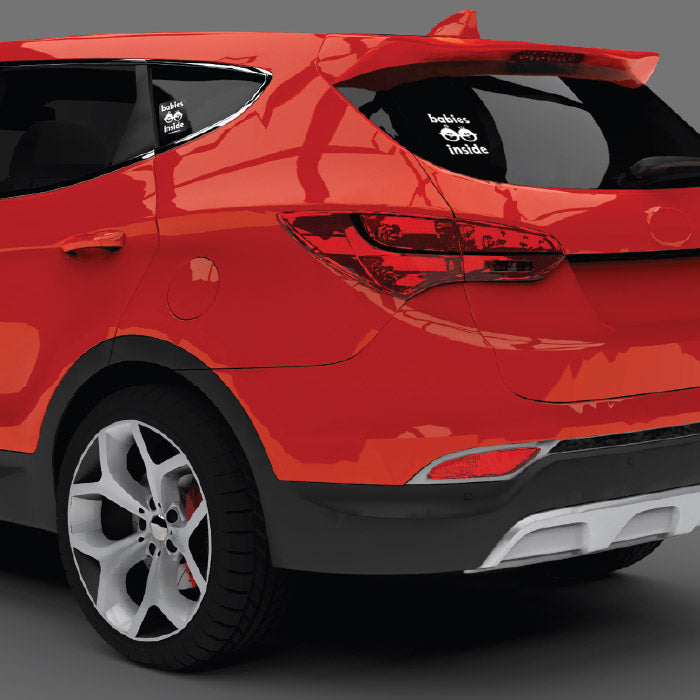 Picture of Babies Inside Decal set showing back window decal and left side sticker on a red SUV.