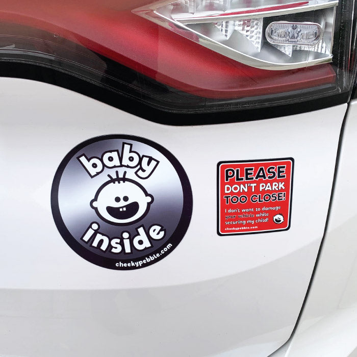 Please Don’t Park Too Close Child Specific magnet with Baby Inside round magnet. Both by Cheeky Pebble on white vehicle.