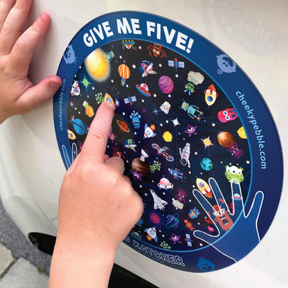 Give Me Five Kid Katcher Magnet Space Design by Cheeky Pebble. Closeup of Space magnet on white vehicle with young child’s hands pointing out a spaceship.