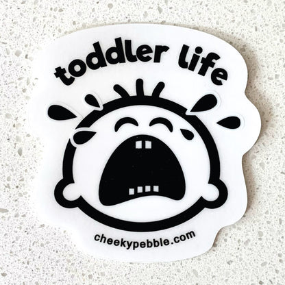 Toddler Life Clear Sticker by Cheeky Pebble. Our Cheeky crying toddler face is a clear sticker with solid white background behind the face and tears. behind the face and tears.